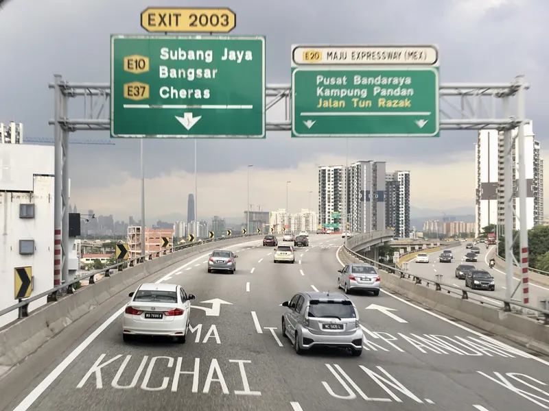 Signs at the Kuchai Lama interchange (Exit 2003) of the Maju Expressway, with KUCHAI painted on the road